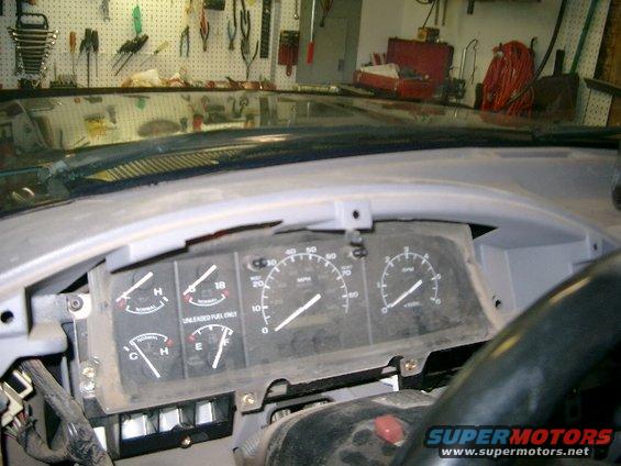 1995 Ford Bronco dashboard with speedometer, fuel gauge, and tachometer visible
