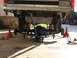 1996 Ford Bronco - The rear suspension of a 1996 Ford Bronco is elevated on jack stands for maintenance, with a floor jack positioned underneath.