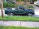 1970 Ford Ranchero - A green Dodge Dakota Sport pickup truck is shown from the side, custom chrome wheels and a tonneau cover.