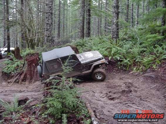 Jeep avioding a big stump (3 pics)
