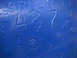 1968 Ford Mustang - Close-up of a blue metal part showing the embossed numbers 427.