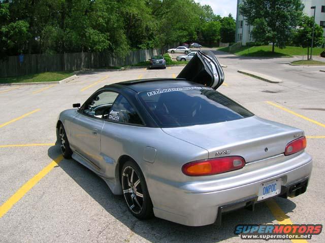 lambo3.jpg Newest mods, including:

Black Roof
Black rear bumper "diffuser"
Lambo Door
Shaved spoiler, antenna and rear side marker lights