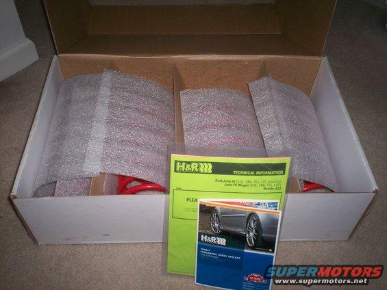 Box of H&R suspension springs and wheel spacers with technical information documents