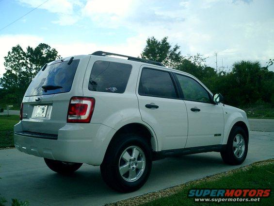 White 2008 Ford Escape parked on a driveway, rear-left view