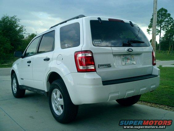 Rear view of a white 2008 Ford Escape parked on a driveway