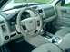 2008 Ford Escape - The interior of a 2008 Ford Escape is visible, the dashboard, steering wheel, and center console area.