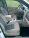 2008 Ford Escape - The interior of a 2008 Ford Escape, dual-tone cloth seats and a clean dashboard layout.