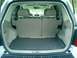 2008 Ford Escape - The cargo area of a 2008 Ford Escape is shown with the rear seats folded flat.