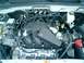 2008 Ford Escape - The engine compartment of a 2008 Ford Escape is visible, with various components and wiring harnesses.