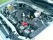 2008 Ford Escape - The engine bay of a 2008 Ford Escape is shown from a high angle, revealing the V6 engine and its components.