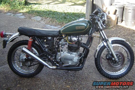Green Yamaha motorcycle parked outside
