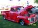 1972 Ford Ranchero - Red 1950 Chevrolet 3100 pickup truck shown with its hood open at an outdoor event.