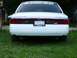1997 Mercury Grand Marquis - Rear view of a 1997 Mercury Grand Marquis, showing the taillights and license plate.