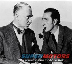 Two men in suits looking at each other, one with a pipe