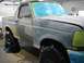 1996 Ford Bronco - A Ford Bronco is undergoing body repair, with its windows and lights taped off.