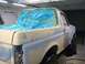 1996 Ford Bronco - This vehicle is undergoing body repair work, with masking tape and plastic covering the windows.