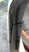 1979 Ford Bronco - Detail of a corroded and bent car door frame, indicating significant wear and tear.