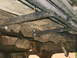 1990 Ford Bronco - This photo shows the undercarriage of a vehicle, highlighting the sliders that have been mounted.