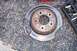 1992 Ford Crown Victoria - A brake rotor and pads are shown next to a tool kit on a textured surface.