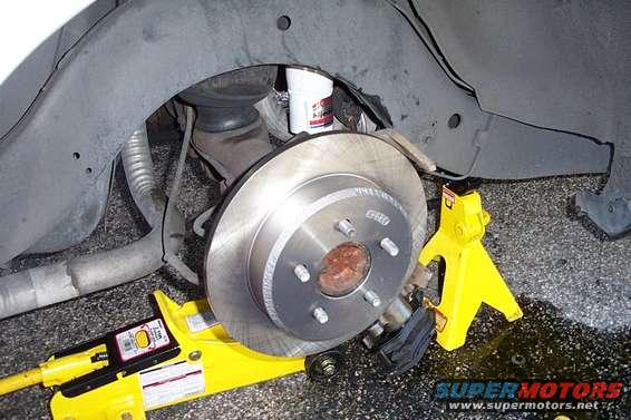 Car brake rotor, caliper, suspension, jack, and jack stand
