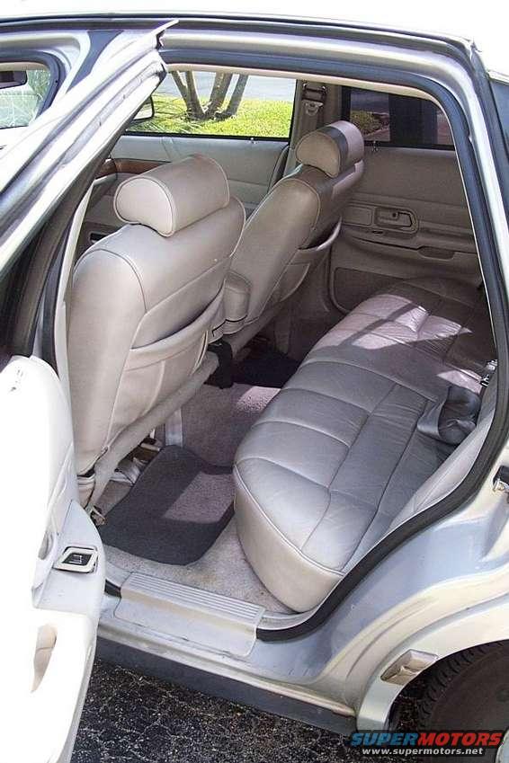 Rear interior of 1992 Ford Crown Victoria, showing gray leather seats and door panels