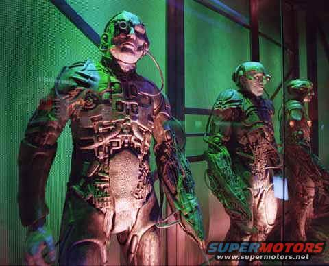 cyborg figures with metallic bodies and green lighting