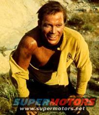 William Shatner as Captain Kirk in yellow Starfleet uniform, dirt on face and shirt