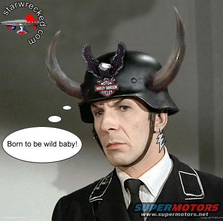 Man wearing a helmet with horns and a Harley-Davidson emblem, with a thought bubble saying 'Born to be wild baby!'