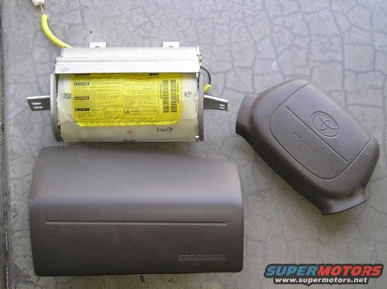 Toyota airbag module, steering wheel airbag cover, and dashboard trim piece with 'SRS AIRBAG' text