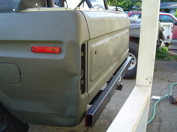 Green 1978 Ford Bronco rear quarter panel with aftermarket bumper