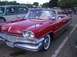 1970 Ford Ranchero - A classic red Dodge convertible is parked at an outdoor car show.