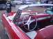 1970 Ford Ranchero - The interior of a red convertible shows off its classic design and chrome accents.