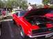 1970 Ford Ranchero - Red 1967 Chevrolet Camaro convertible at a car show, hood open showing the engine.