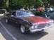1970 Ford Ranchero - A custom 1969 Chevrolet El Camino SS with a two-tone paint job is displayed at an outdoor event.