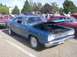 1970 Ford Ranchero - Blue 1969 Plymouth Road Runner displayed at an outdoor car show event.