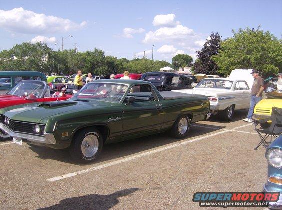 Green 1970 Ford Ranchero pickup parked at an outdoor car show