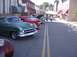 1970 Ford Ranchero - Several vintage cars are lined up on a street, possibly for a car show or event.