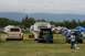 1990 Chevrolet Suburban - A gathering of vehicles and recreational vehicles in an outdoor setting.