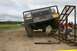 1990 Chevrolet Suburban - A modified pickup truck navigates an obstacle course with people nearby.