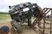 1990 Chevrolet Suburban - Off-road vehicle navigating a challenging obstacle course with a metal ramp.