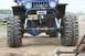 1990 Chevrolet Suburban - This modified Jeep Wrangler features massive off-road tires and a front-mounted winch, with an Alaska license plate visible.