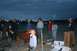 1990 Chevrolet Suburban - People gathered around a fire pit during an evening event.