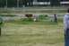 1990 Chevrolet Suburban - Children play in a field near a motel with a 'Rooms $69' sign.