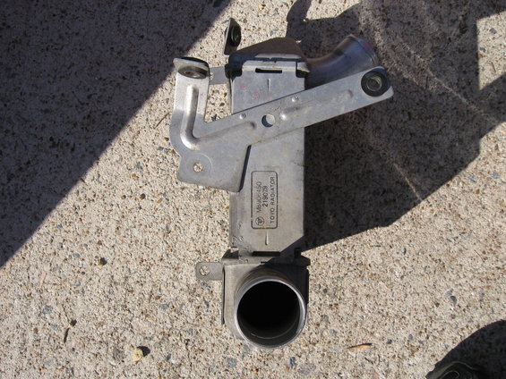 Metal radiator part with text 'TOYO RADIATOR' and part number MNUG-450 219039