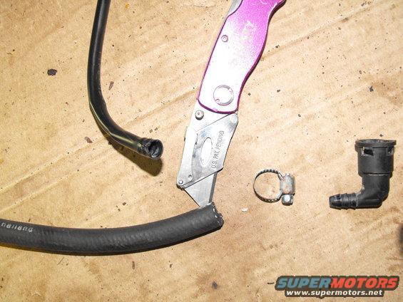 dscf0257.jpg Just slice down the side of the plastic line and free the perfectly re-usable barbed fitting. Slide it inside the high pressure fuel hose and clamp it.