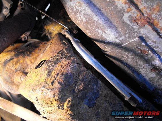 A couple of nearly perfect 90 degree bends secured tight to the frame rail by the factory clamp and that great ratchet wrench.