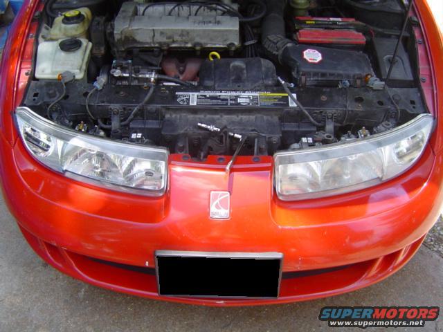 Red 1997 Saturn SC engine bay with hood open