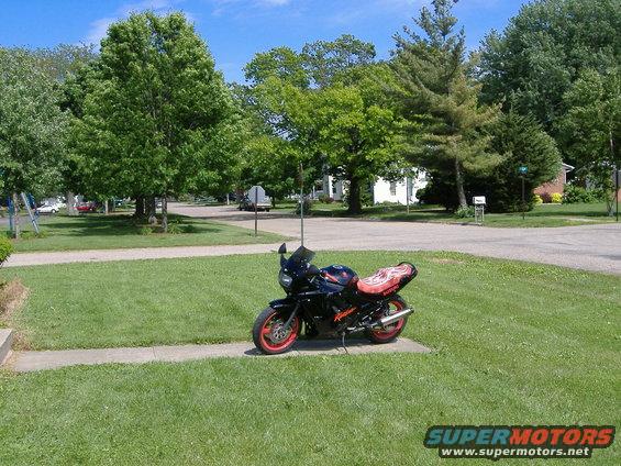 1992 Suzuki GSX600F Katana parked on a sidewalk in a residential area