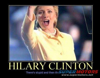 Hillary Clinton with her arm raised and mouth open, wearing a yellow shirt and pearl necklace