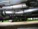1997 Mercury Grand Marquis - Custom exhaust modification showing the Y-pipe and driveshaft connection.